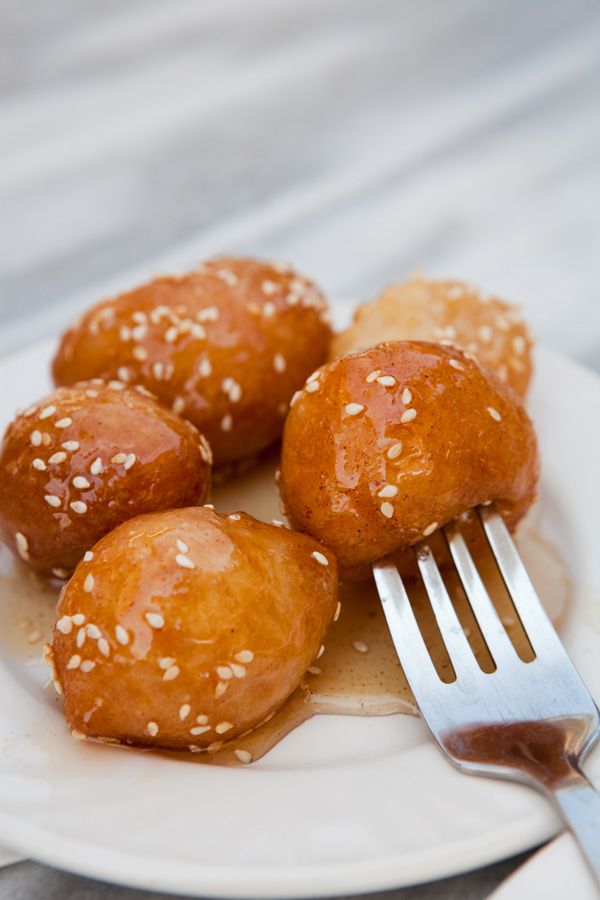 Loukoumades (Greek doughnuts) with honey and sesame - www.olivemagazine.gr