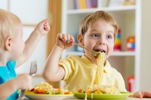 35418213 – kids eating food in nursery or at home