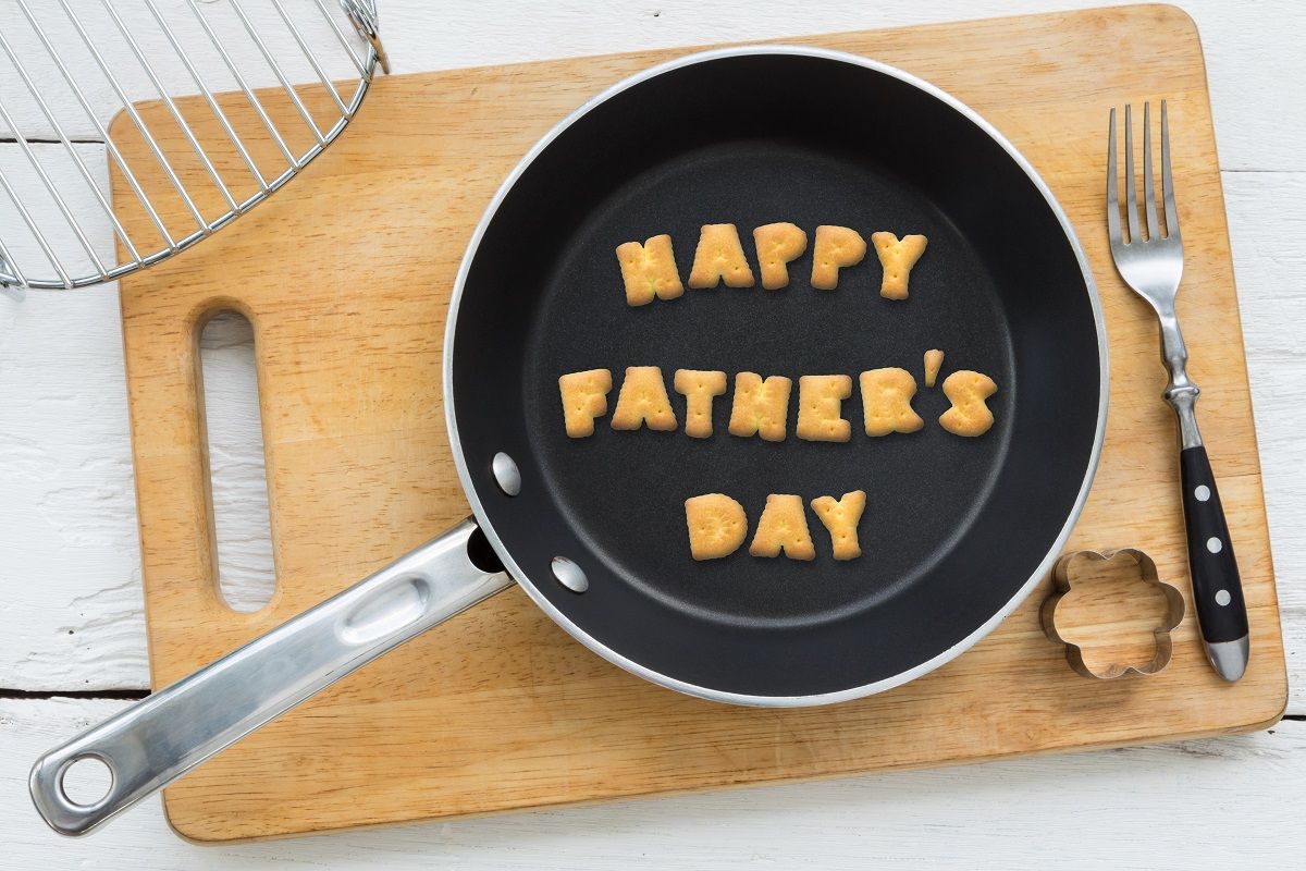 Cookie biscuits word HAPPY FATHER’S DAY in frying pan