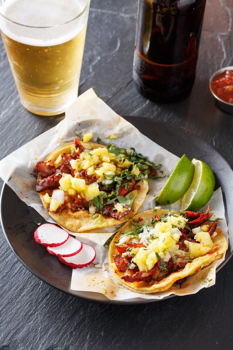 beer and street tacos with pineapple garnish