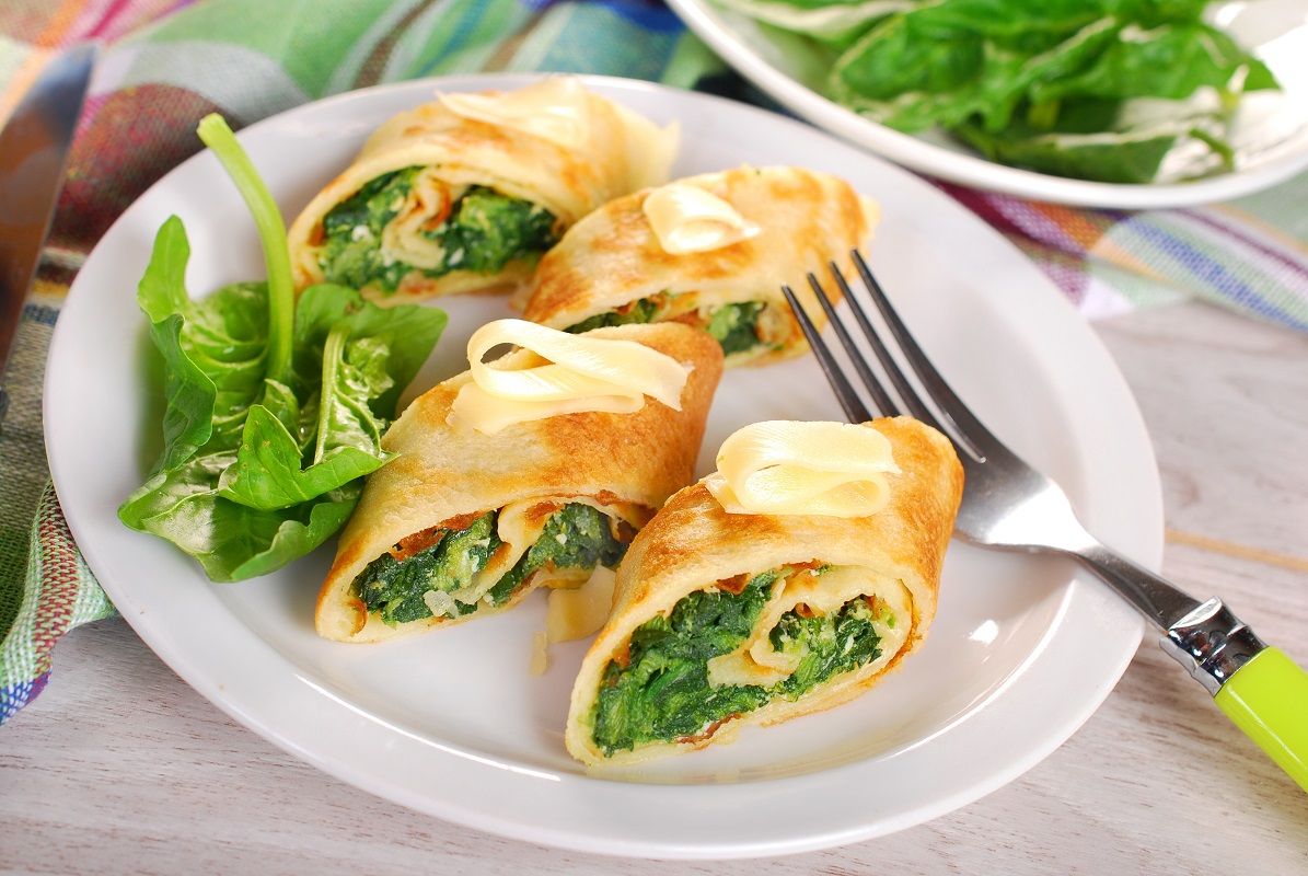 rolled spinach pancakes cut into small pieces