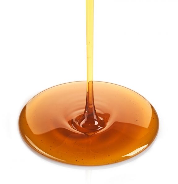 21377697 – maple syrup on a white background