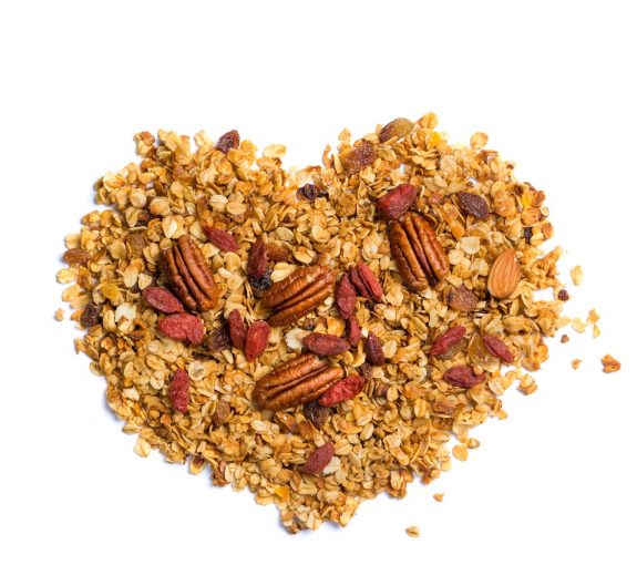 Healthy diet concept – heart shaped granola with nuts