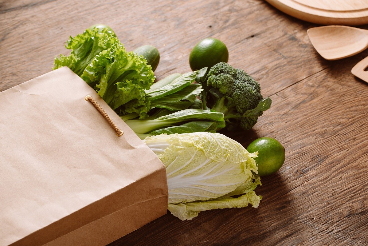 fresh vegetables in a brown paper bag