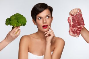 Healthy Beautiful Woman Choosing Between Meat And Broccoli