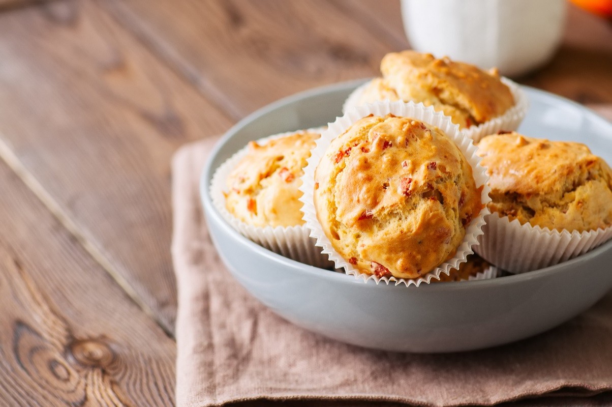 Homemade muffins with bacon and cheese in a gray plate. Healthy