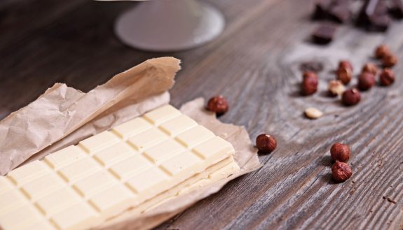 White chocolate on a wood background