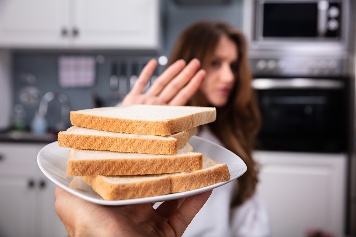 Woman Refusing Bread Slice
