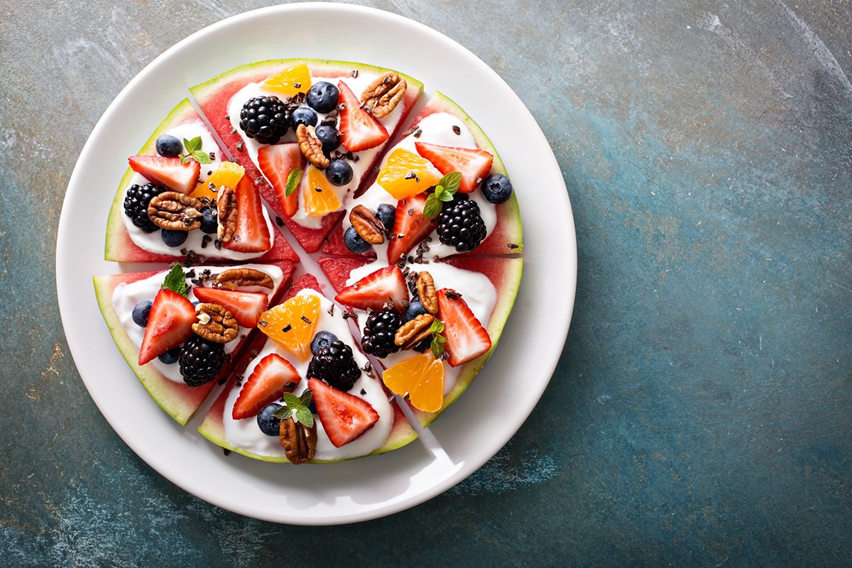 Watermelon pizza with fruits and yogurt