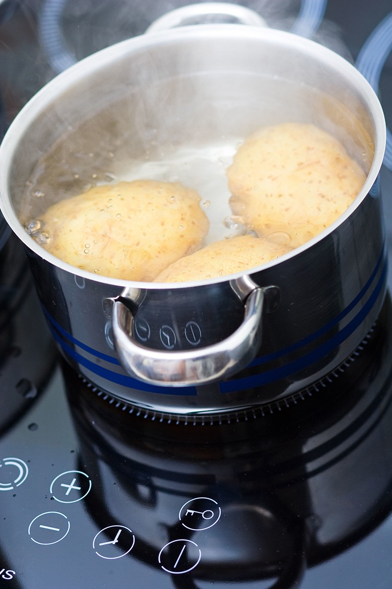 4554019 – potato boiling in water
