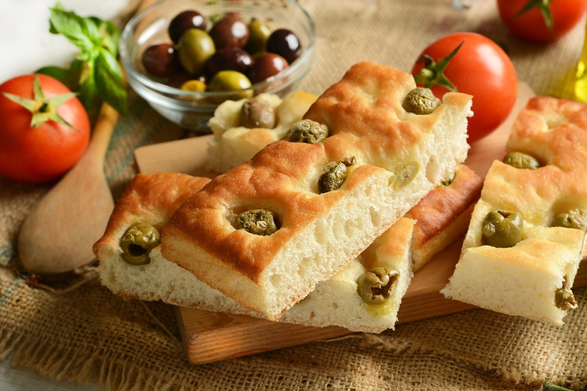 traditional Italian focaccia with olives on the table