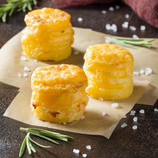 Mini stacks of potato gratin with cheese and rosemary, beautiful