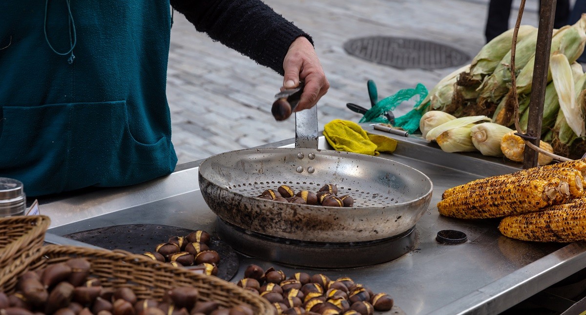 Street food. Grilled sweet corn and chestnuts, Ermou street Athens, Greece.