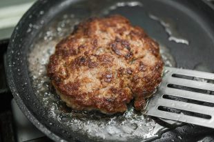 burger cutlet on metal pan