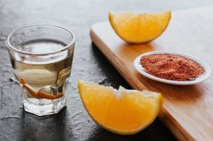 mezcal shot with chili salt and agave worm, mexican drink in mexico