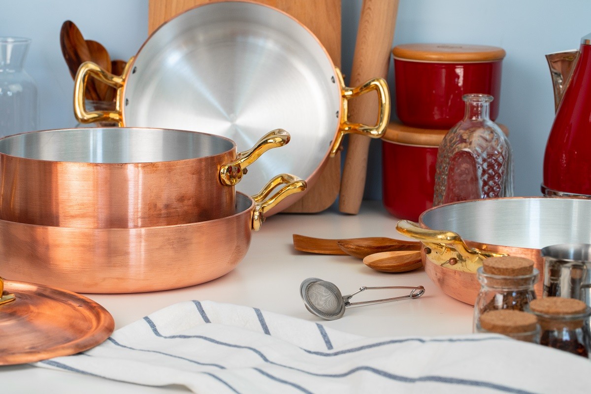 Close up of modern kitchen interior with copper cookware