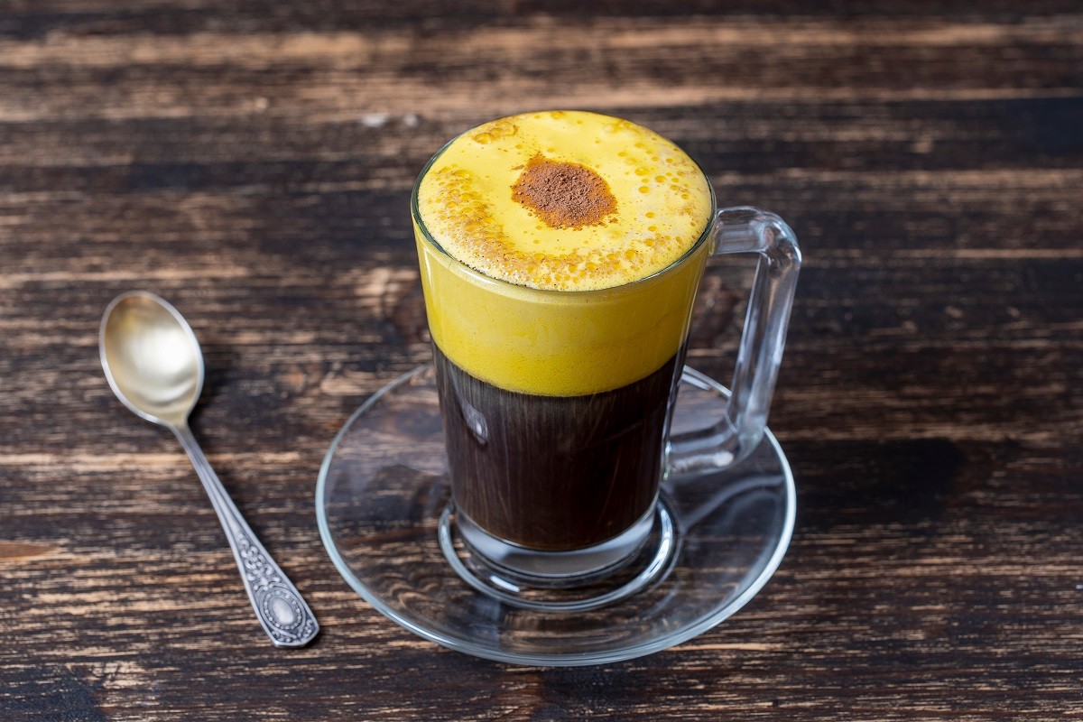 Traditional vietnamese egg coffee made of raw egg yolk and condensed milk, close up