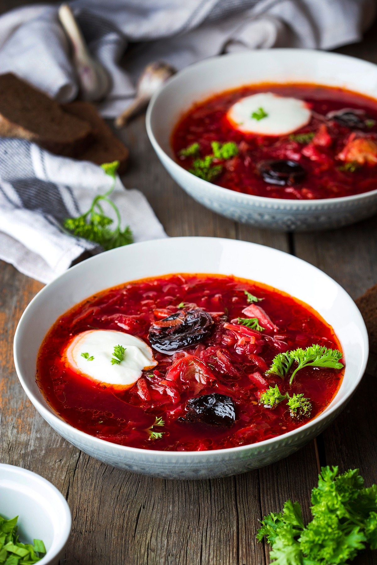 Traditional borscht with prunes and sour cream