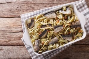 Italian food: pasta with sardines, fennel, raisins and pine nuts