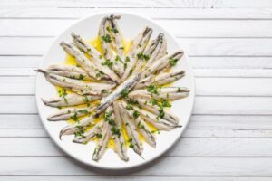 Marinated anchovies with olive oil and parsley