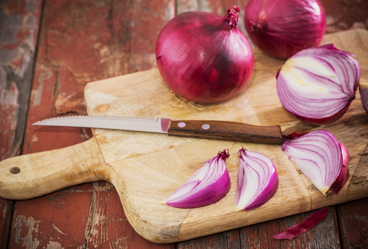 red onion on old wooden background