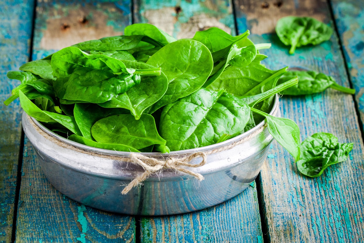 raw fresh organic spinach in a bowl