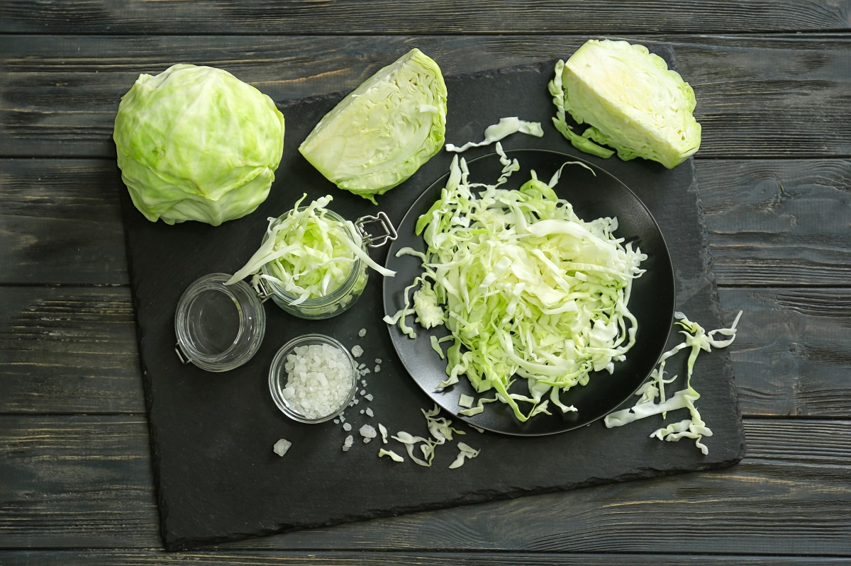Composition,With,Cut,Cabbage,On,Wooden,Table