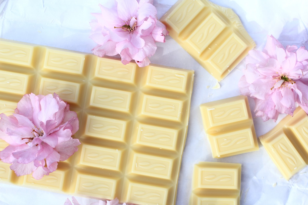 A bar of white chocolate with Japanese cherry blossom flowers