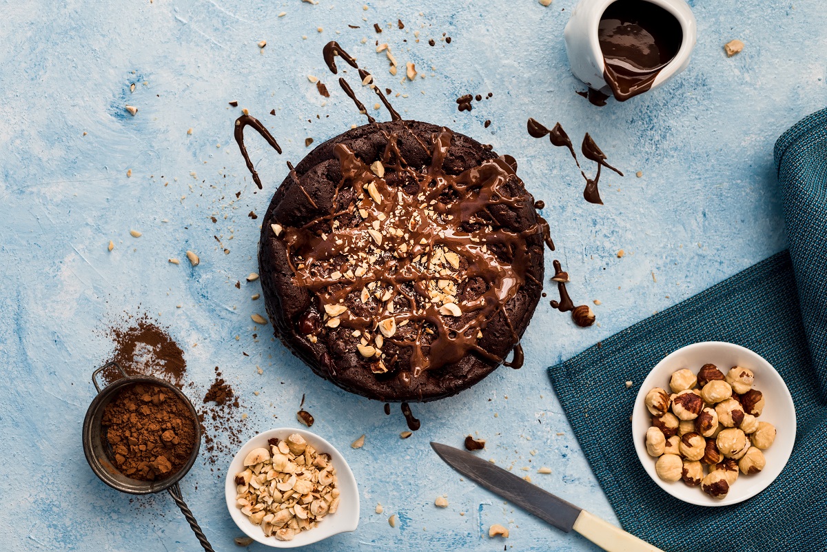 Chocolate,Cake,With,Chopped,Hazelnuts,And,Spilled,Chocolate,On,A