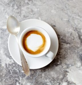 Cup,Of,Espresso,Macchiato,On,Gray,Stone,Background;,Seen,From