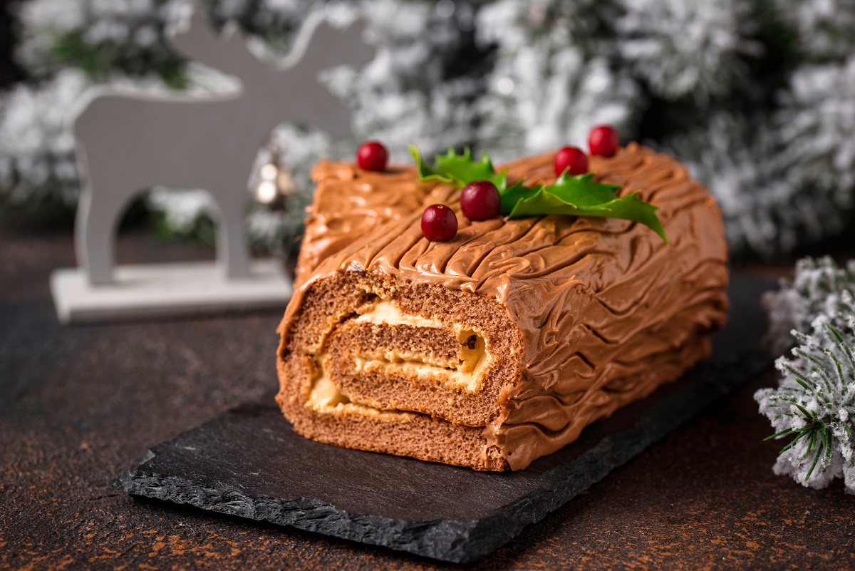 Christmas,Yule,Log,Cake.,Traditional,Chocolate,Dessert,On,Festive,Background