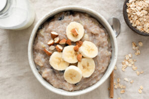 Oatmeal,Porridge,With,Banana,And,Almonds.,Healthy,Vegan,Breakfast,On