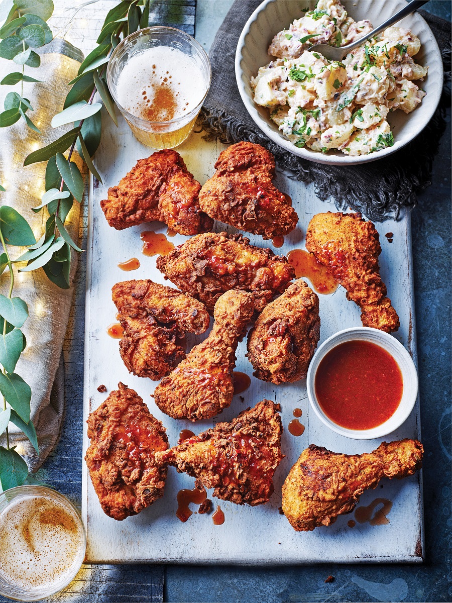 fried chicken with tamarind and chilli sauce and potato salad