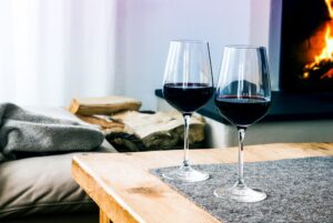 Close-up,Of,Two,Glasses,With,Red,Wine,On,Table,In