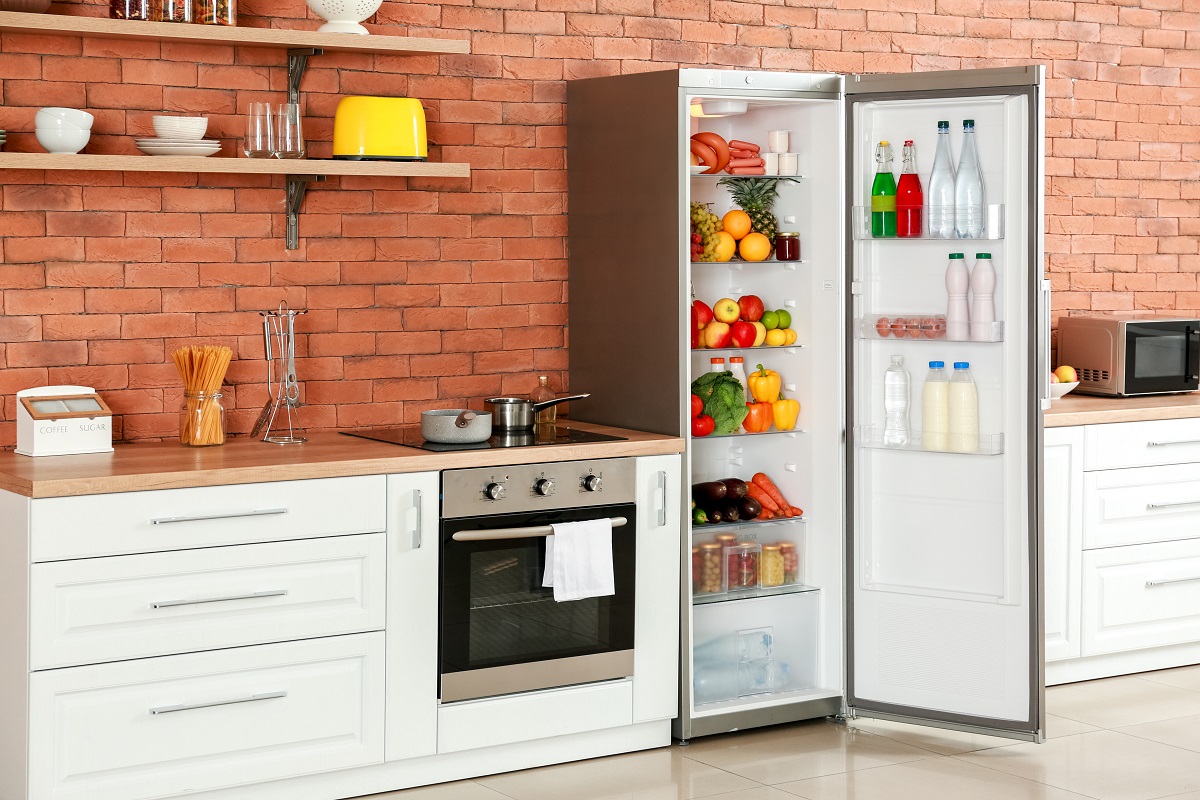 Open,Big,Fridge,With,Products,In,Interior,Of,Kitchen