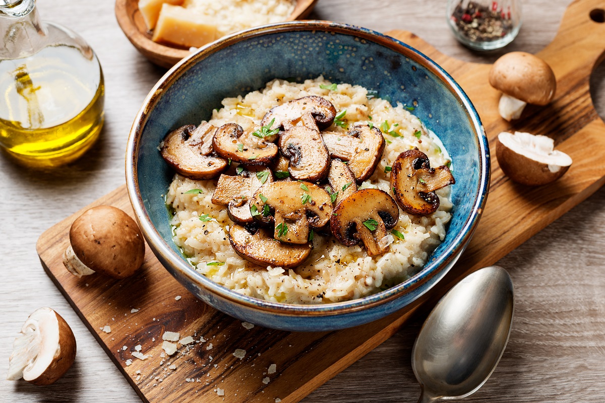 Risotto,With,Brown,Champignon,Mushrooms,On,Wooden,Background.