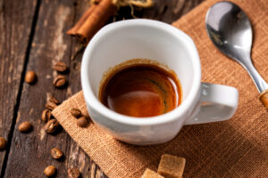Ristretto,,Short,Shot,,Of,Highly,Concentrated,Espresso,Coffee,,Wooden,Background,