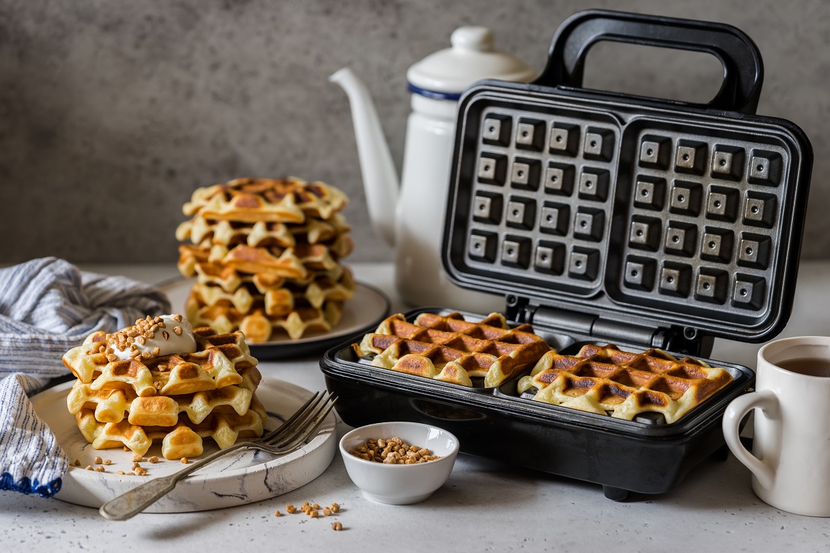 Waffles,Being,Baked,In,The,Waffle,Maker,,Square