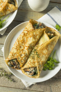 Savory,Homemade,Mushroom,And,Spinach,Crepes,With,Cheese