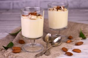 Vanilla,Mousse,Pudding,With,Almonds,On,A,Wooden,Background.