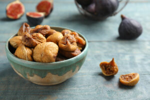 Bowl,With,Delicious,Dried,Figs,On,Wooden,Table.,Organic,Snack