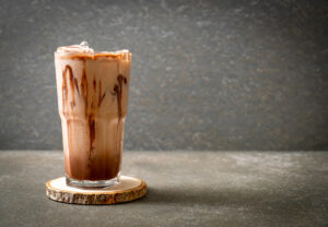Iced,Chocolate,Milkshake,Drink,On,Wood,Background