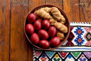 Easter,Eggs,And,Cookies,On,A,Traditional,Greek,Woven,Textile