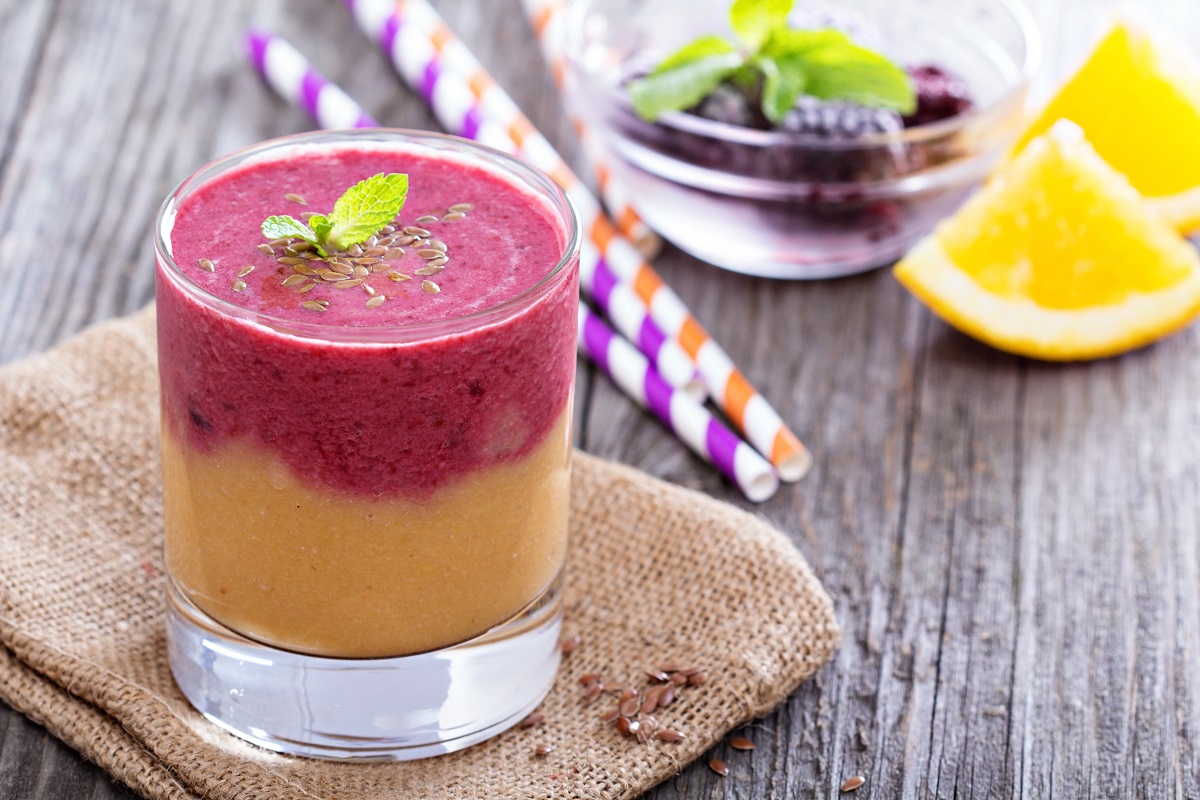 Two,Layered,Smoothie,With,Peach,,Orange,And,Blackberries
