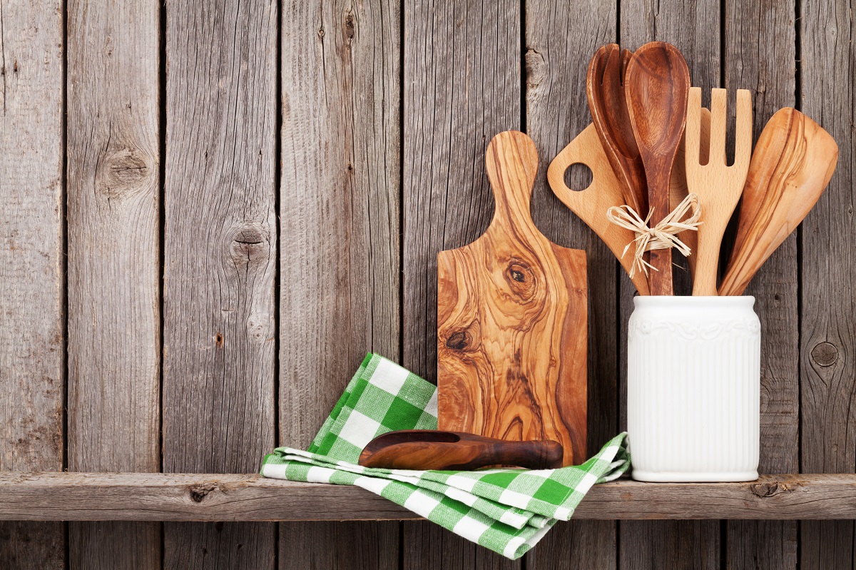 Kitchen,Cooking,Utensils,On,Shelf,Against,Rustic,Wooden,Wall,With