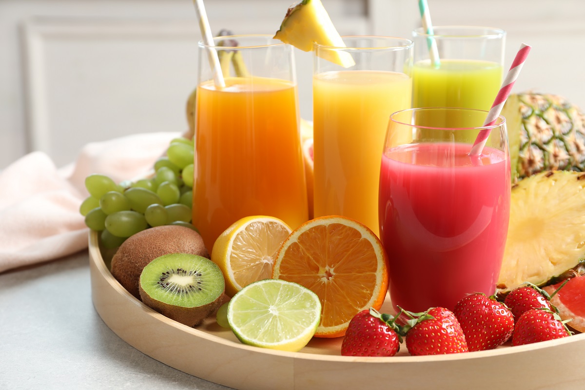 Wooden,Tray,With,Glasses,Of,Different,Juices,And,Fresh,Fruits