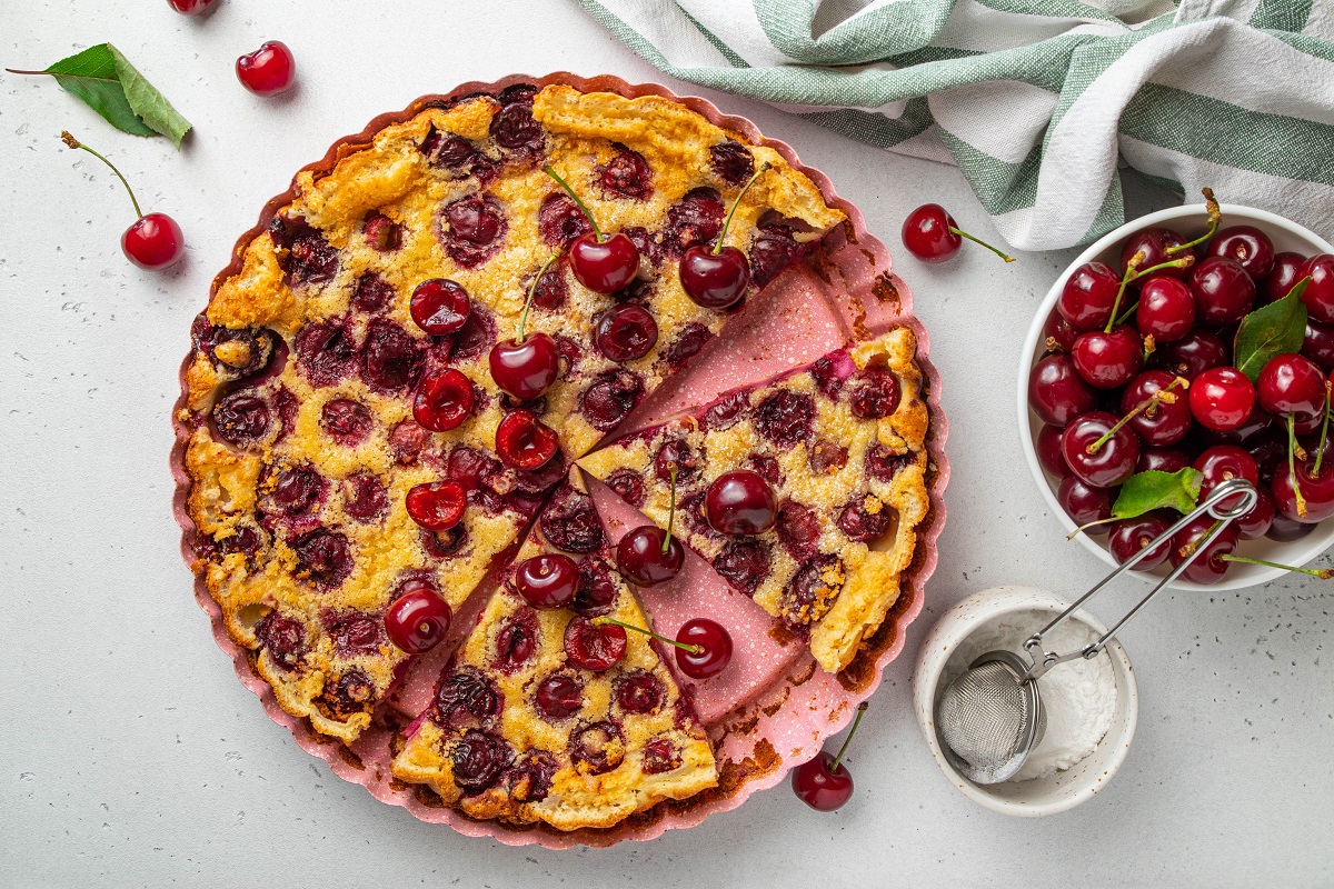 Sliced,Clafoutis,With,Cherry,On,Light,Background.,Traditional,Homemade,French