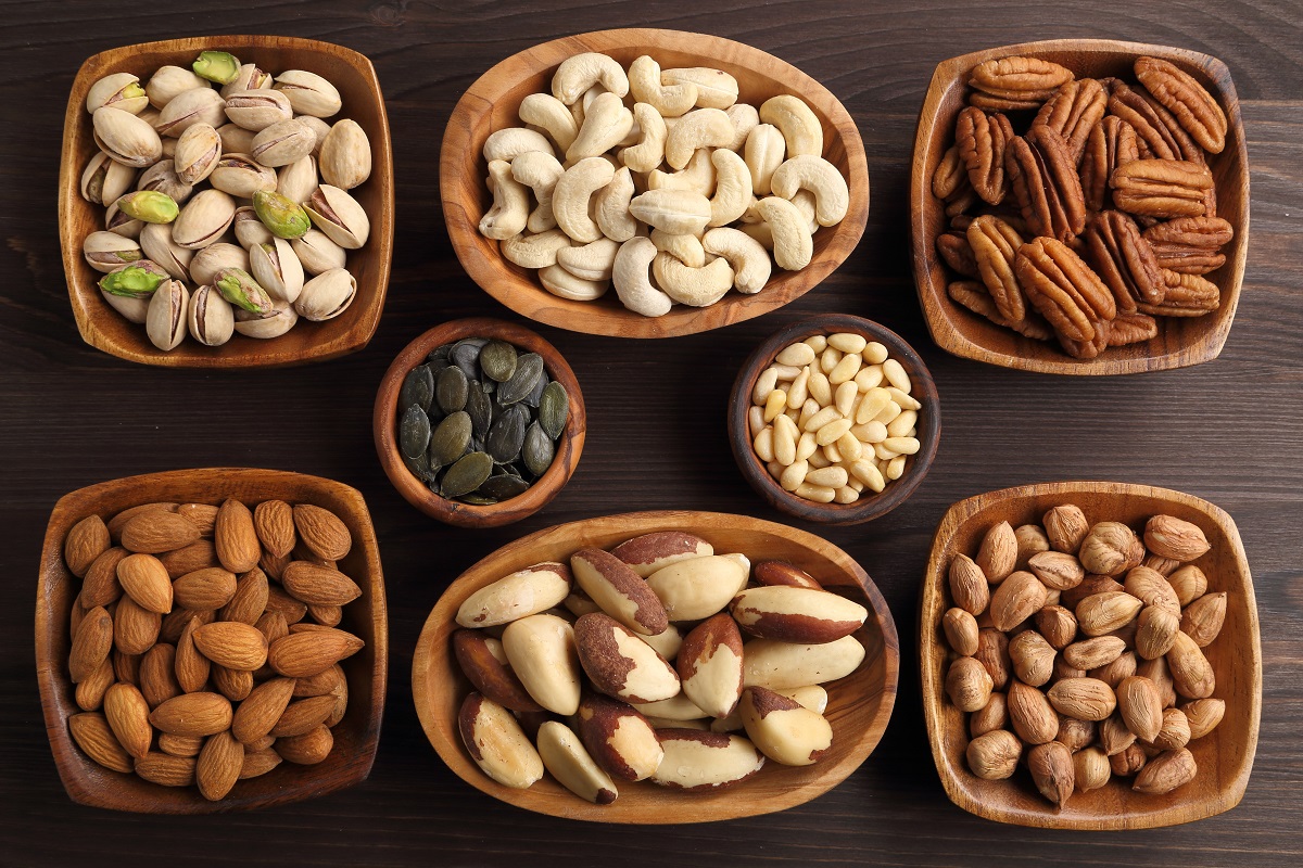 Different,Kinds,Of,Nuts,In,Wooden,Bowls.