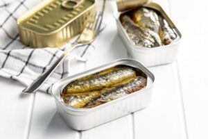 Canned,Sardines.,Sea,Fish,In,Tin,Can,On,White,Wooden