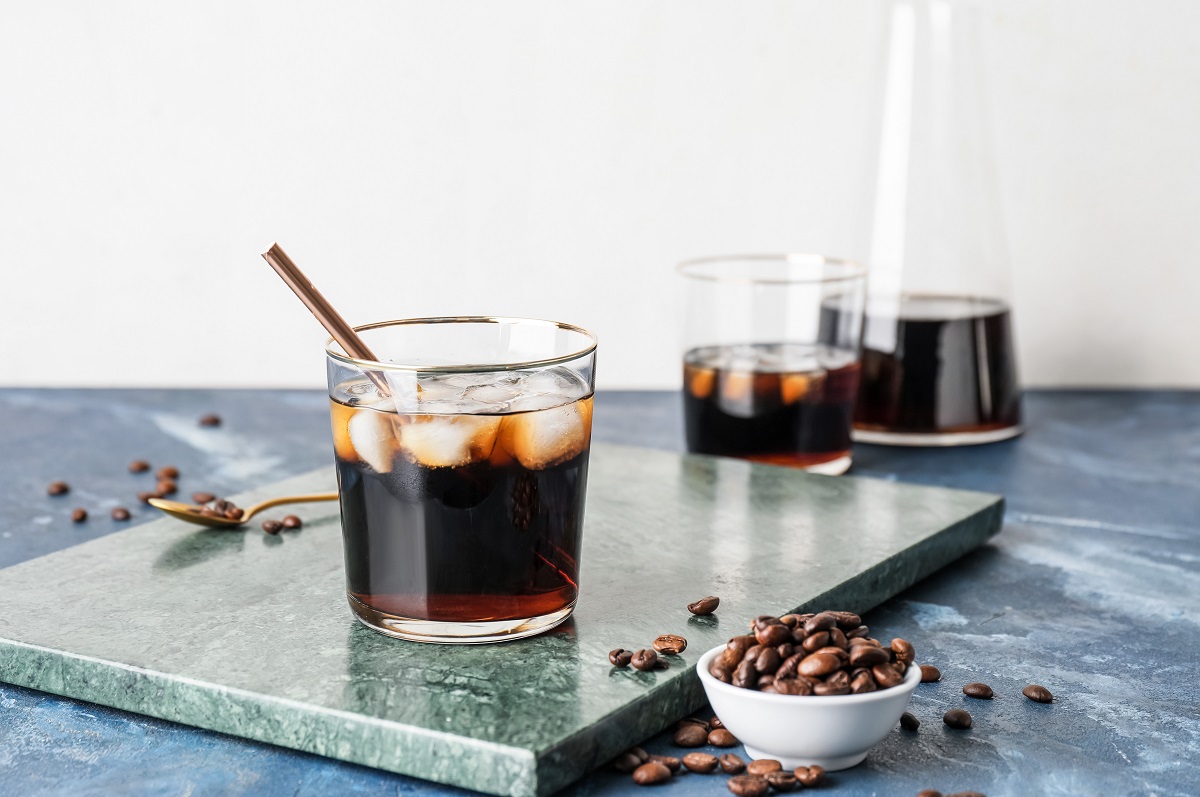 Glass,Of,Cold,Brew,With,Straw,And,Coffee,Beans,On